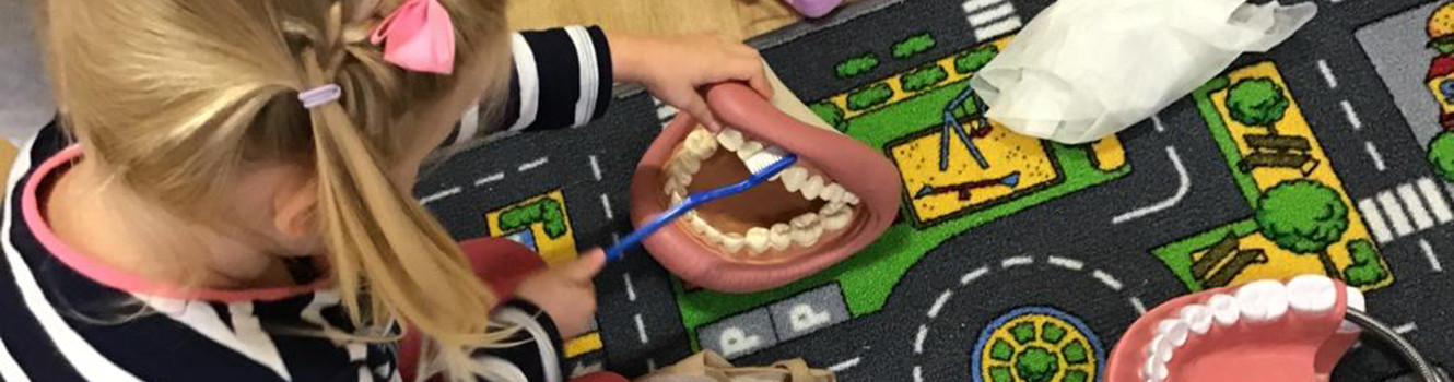 Girl playing on the mat