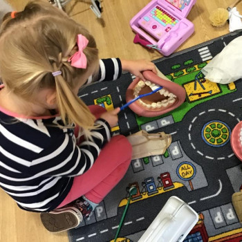Girl playing on the mat