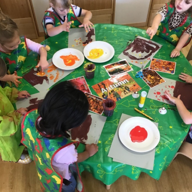 Children working on a table with crafts