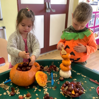 Children carving Pumpkins