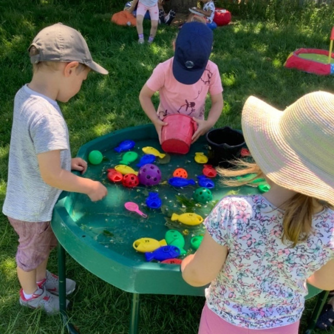 Children playing with toys in the garden