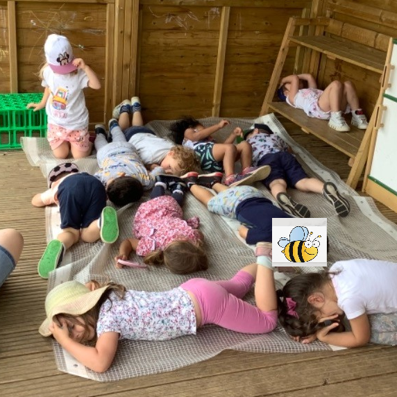 Children playing sleeping lions