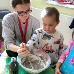 Child doing crafts and playing