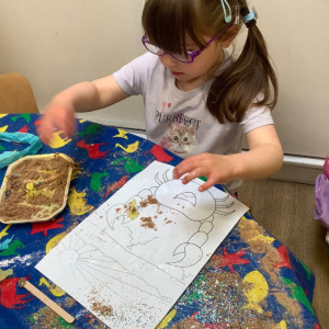 Child doing a painting. 