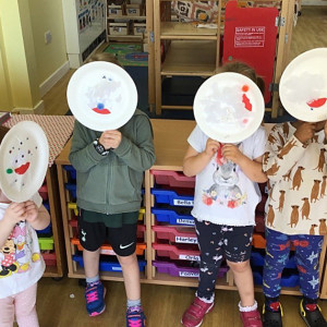 Children holding face masks