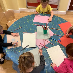 Children drawing pictures of their homes
