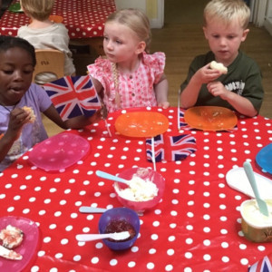 Children eating scones. 