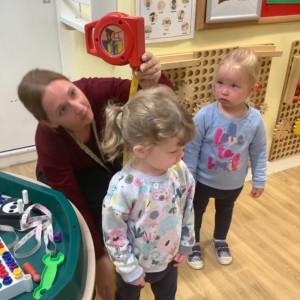 Children measuring their height