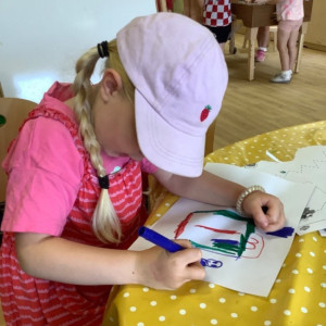 A child doing a craft. 