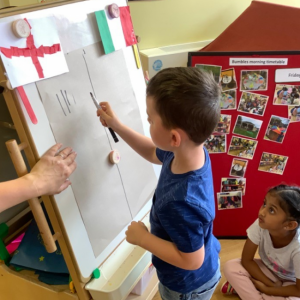 Child drawing on a board