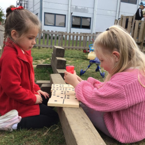 Children playing dominoes. 