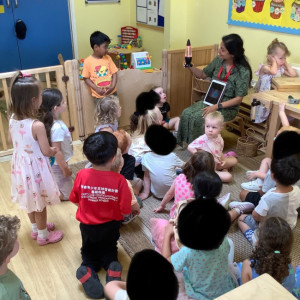 Children in a group listening to a talk
