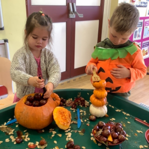 Children carving Pumpkins