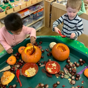 Children carving Pumpkins