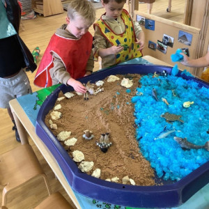 Children playing with sand. 
