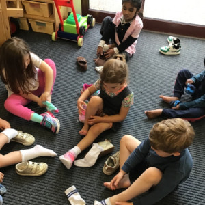 Children putting on shoes