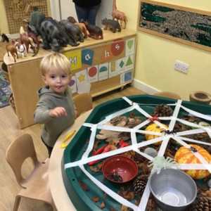 Child doing crafts and playing