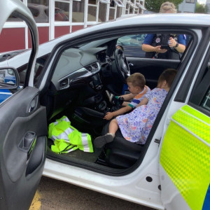 children in a police car