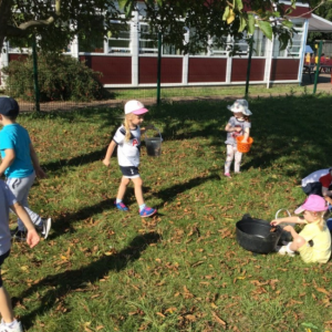 Children looking for bugs outside