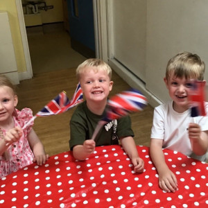 Children waving flags. 