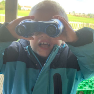 Child looking through binoculars