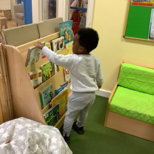 A boy selecting a book