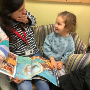 Child and teacher reading