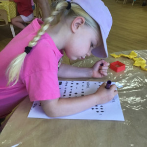 A child practising their writing. 