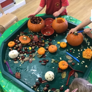 Children carving Pumpkins