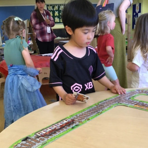 Child playing a train game 