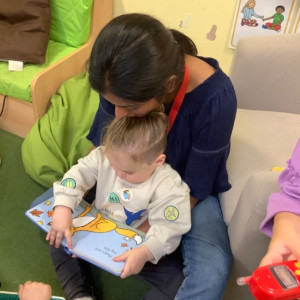 Child and teacher reading 