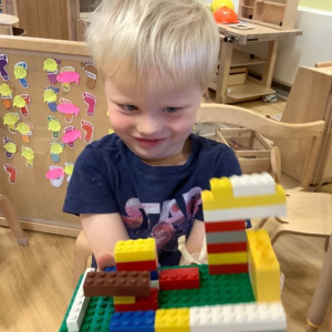 Child paying with Lego