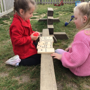 Children playing dominoes. 