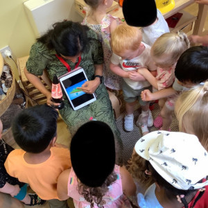 Children in a group listening to a talk