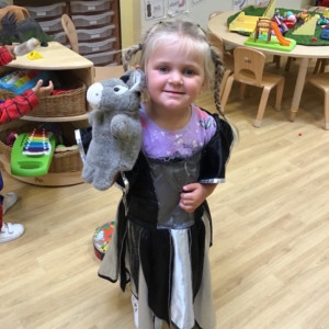 A child playing with a puppet
