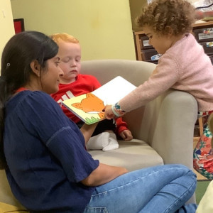 Child and teacher reading 