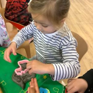 Child doing crafts and playing