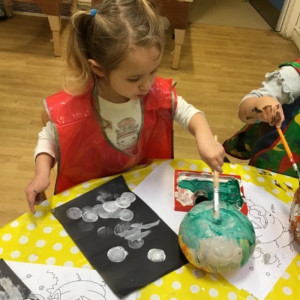 Child doing crafts and playing