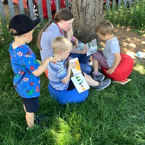Reading a story under a tree