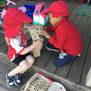 Children playing dominoes. 