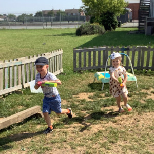 Children playing outside in the sun. 