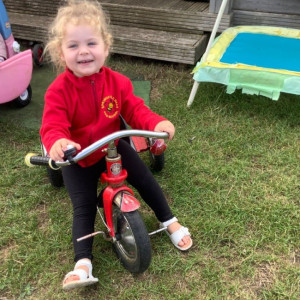 Child playing on a bike 
