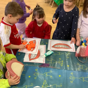 Children looking at teeth