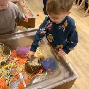 Child doing crafts and playing