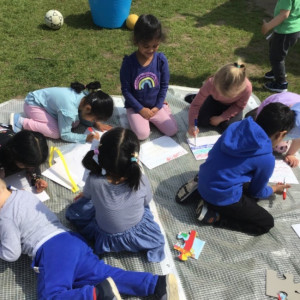 Children drawing outside