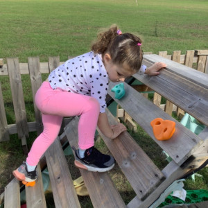 A child climbing over a playground 