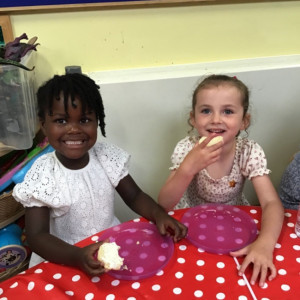 Children eating scones. 