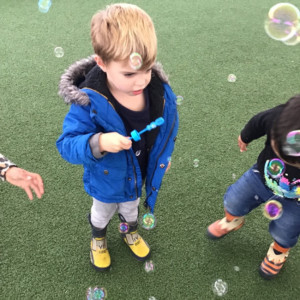 Child blowing bubbles