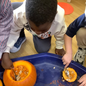Children playing with pumpkins