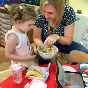Child playing with a teacher